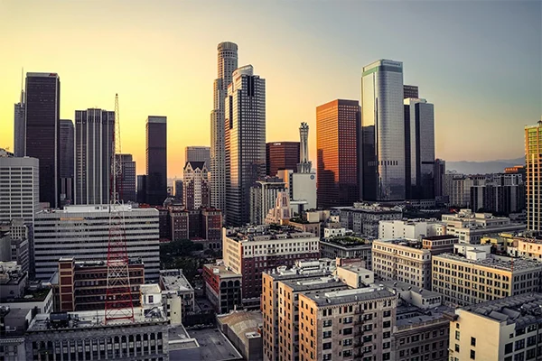 Downtown Los Angeles office towers and apartment blocks in warm light at sunset